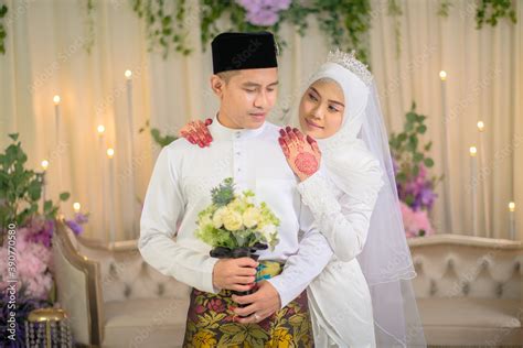 Indoor shooting for Malay wedding, the bride and groom wearing Malay traditional cloth in ...