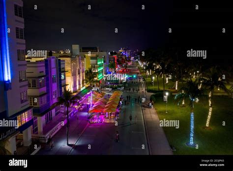 Ocean Drive Miami Beach night neon lights and tourists walking Stock ...