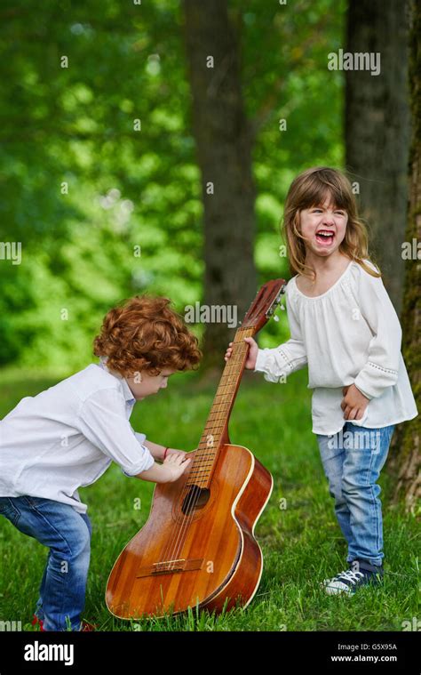 cute children playing guitar Stock Photo - Alamy