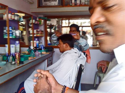 Stock Pictures: Indian Hair stylists at work in small salons