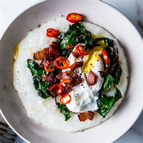 Cheesy Grits with Poached Eggs, Greens, and Bacon Recipe | Bon Appétit