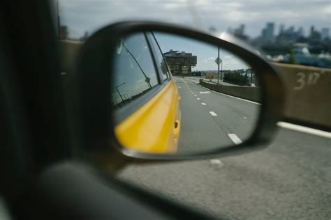 Reflection of city road in side mirror · Free Stock Photo