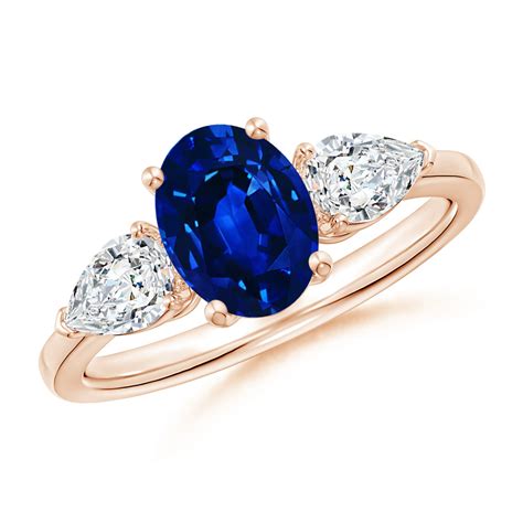 Angara - September Birthstone Ring - Oval Blue Sapphire Three Stone Ring with Pear Diamonds in ...