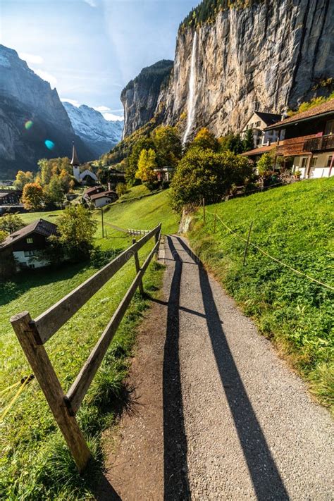 Gorgeous Autumn Landscape of Alpine Village Lauterbrunnen with Famous Church and Staubbach ...