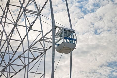 Ferris wheel cabin in amusement park close up blue sky background, Bird ...