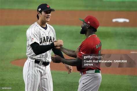 Shohei Ohtani of Team Japan and Randy Arozarena of Team Mexico greet ...