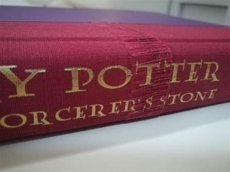 So my child hood harry potter book has this weird stitching on its ...