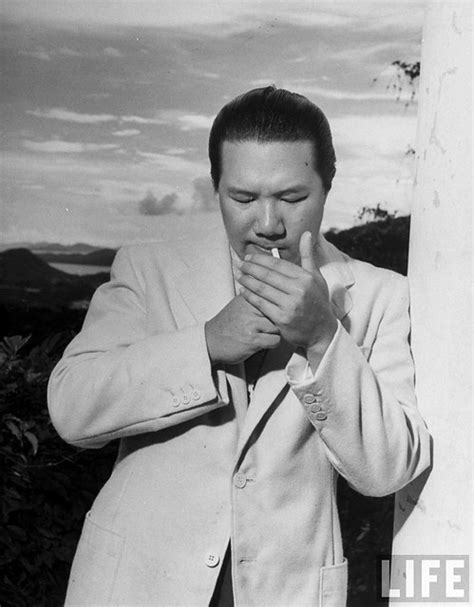 June 1948 - Emperor Bao Dai of Annam lighting cigarette. - a photo on Flickriver