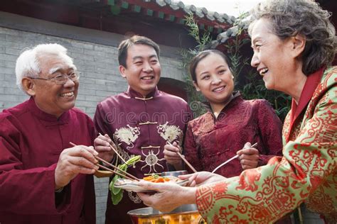 Family Enjoying Chinese Meal In Traditional Chinese Clothing Stock Photos - Image: 33394313