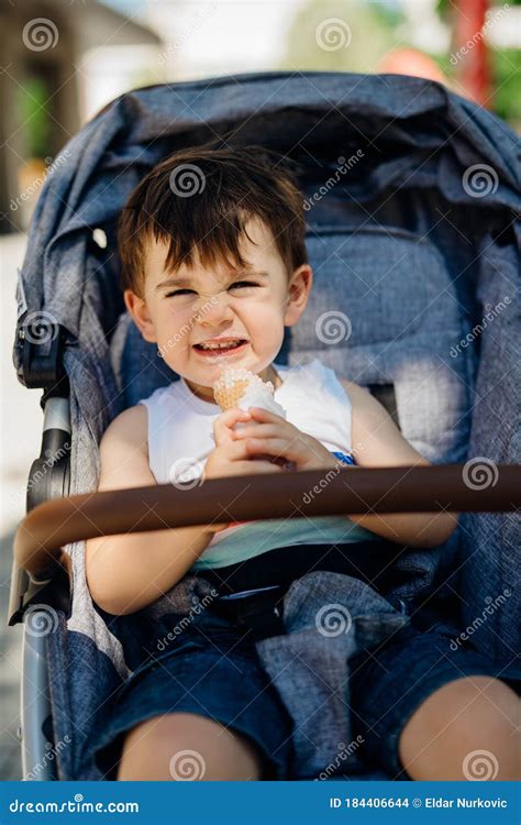 Happy Toddler Eating Ice Cream.Messy Child Eats Frozen Sweet Cone.Kid Eating Sugar and Sweets ...