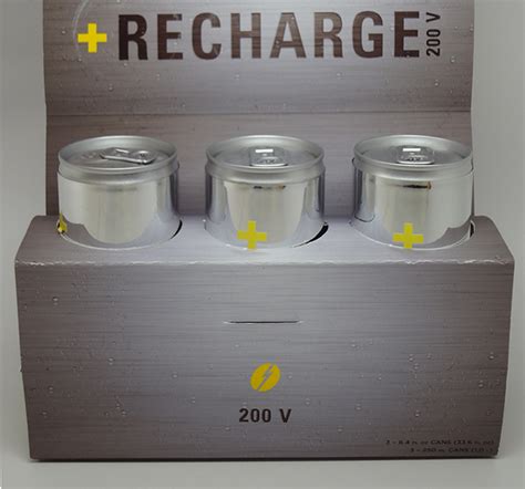 three silver containers with yellow labels on them are in a box that says recharge