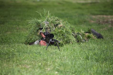 Camouflaged sniper stock image. Image of guerrilla, green - 19844493