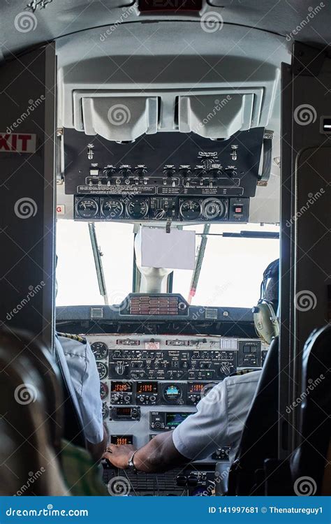 Proitrat View of Cockpit of Beechcraft 1900D in Flight from Passanger Seat Stock Image - Image ...