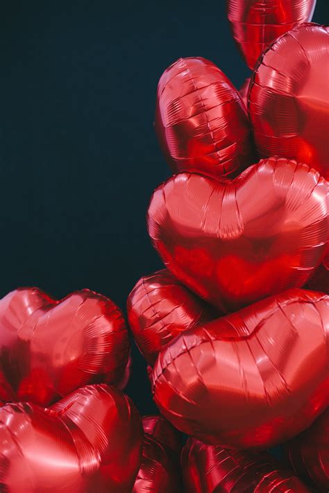 Red Heart Shaped Balloons on Black Background · Free Stock Photo