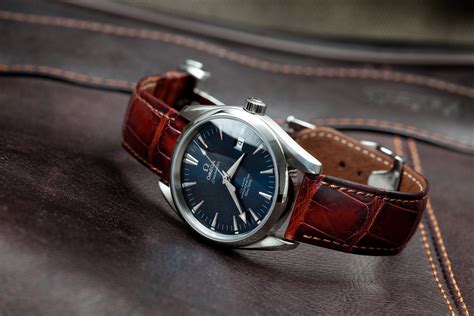 Help me recreate this style: Blue faced Omega watch with red leather ...