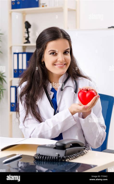 Female doctor cardiologist working in the clinic Stock Photo - Alamy