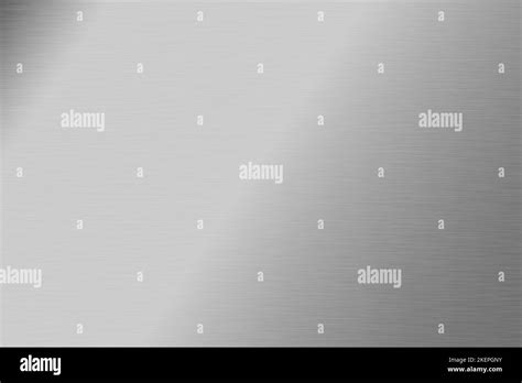 Silver foil background. Metal textured shiny gradient. Stainless glossy surface with reflection ...