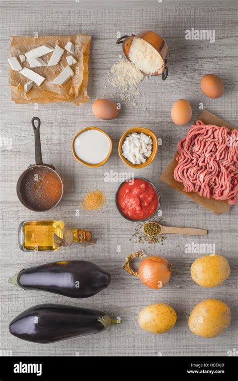 Ingredients for moussaka on the white table vertical Stock Photo - Alamy