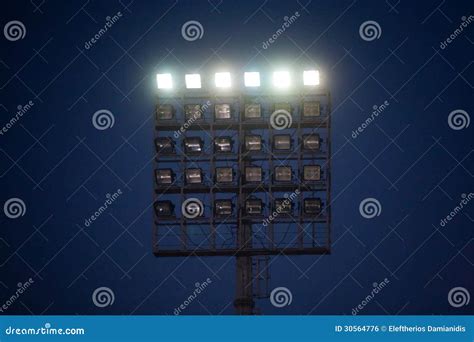 Stadium lights at night stock photo. Image of halogen - 30564776