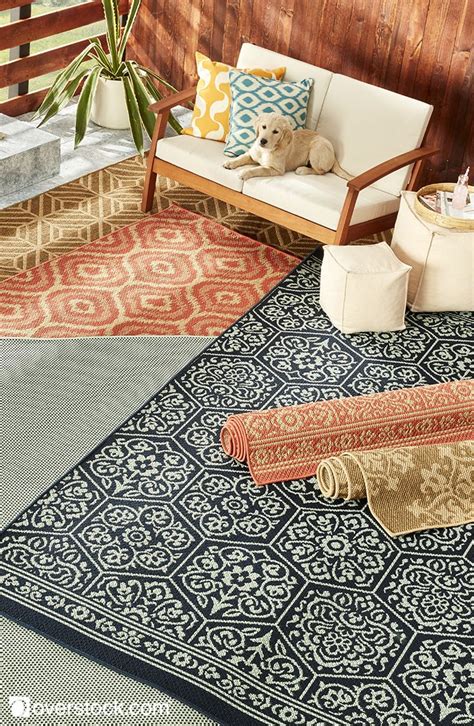 Add a touch of color and warmth to your outdoor living space with an indoor or outdoor rug from ...