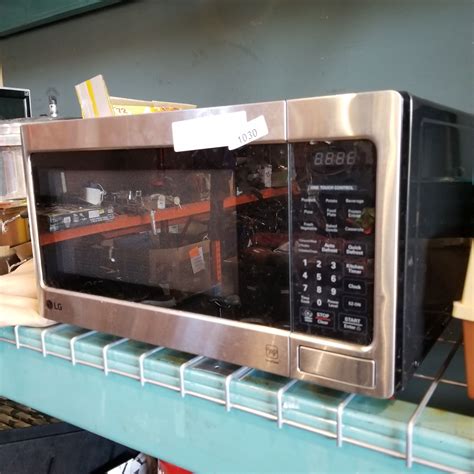 LG STAINLESS AND BLACK MICROWAVE - Big Valley Auction