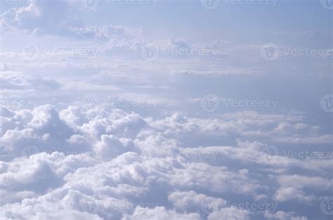 Beautiful cloudy sky from aerial view background. Airplane view above clouds. Sky and cloud ...