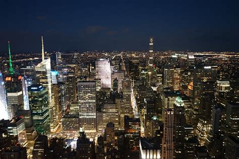 Bright Lights of City Buildings at Night · Free Stock Photo