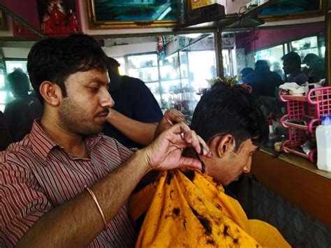 Stock Pictures: Indian Hair stylists at work in small salons