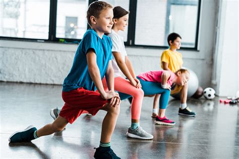 Kids Warming Up Before Training In Gym Stock Photo - Download Image Now ...