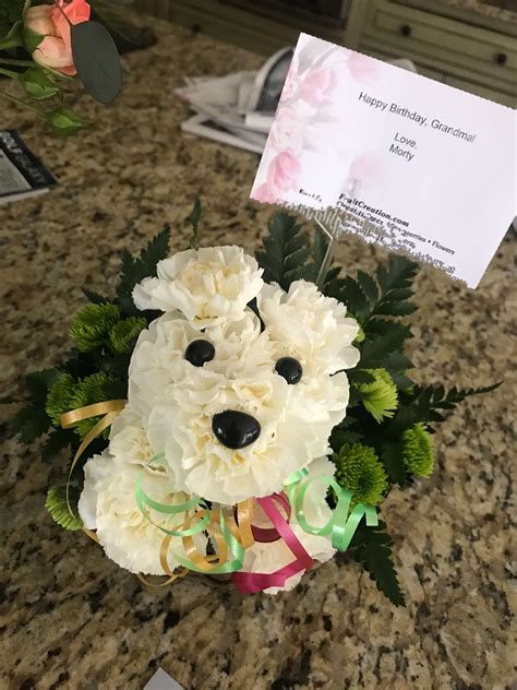 a teddy bear bouquet on a counter with a card for someone's birthday or special occasion