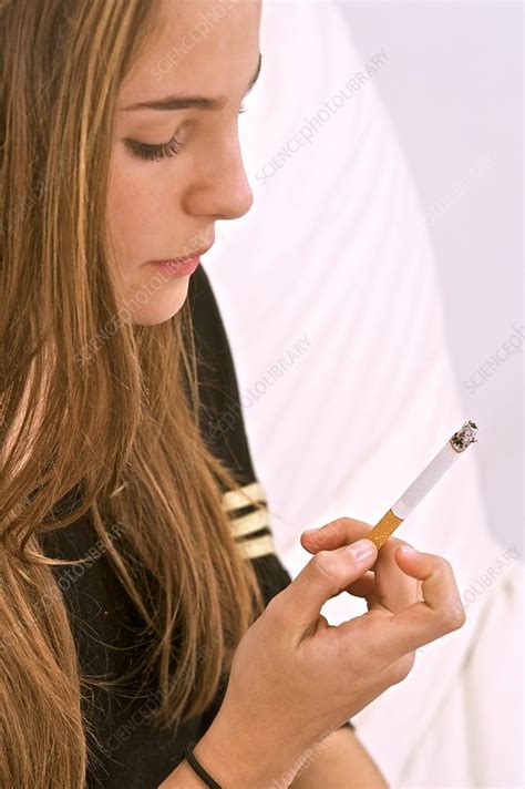 Teenager smoking - Stock Image - C014/0100 - Science Photo Library