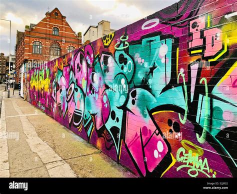 Colourful graffiti on street wall in Shoreditch, London Stock Photo - Alamy