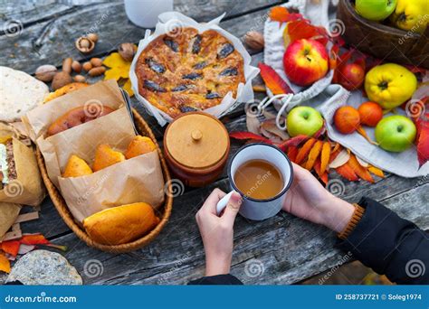 Picnic in the Autumn Season, Food on a Wooden Table, Hot Tea, Pastries ...