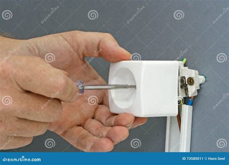 Installing a power outlet stock image. Image of plug - 73580011