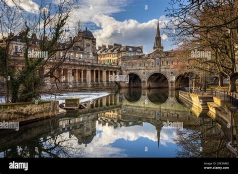 Winter in Bath with the Pulteney Bridge reflecting in the River Avon ...