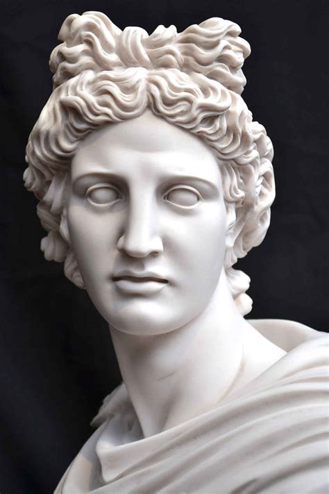 a close up of a statue of a person with curly hair