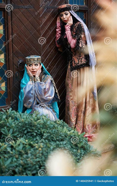 Beautiful Azeri Women in Traditional Azerbaijani Dress Knocking the Wooden Door Stock Image ...