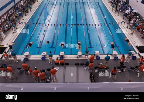 Swim athletes dive in at the Air Force Academy Cadet Natatorium swimming arena during the DoD ...