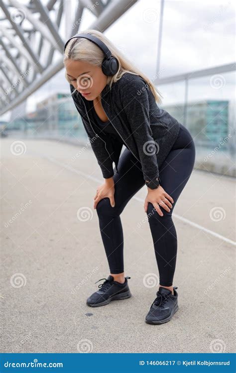 Tired Woman Resting with Hands on Knees after Running Workout Stock Image - Image of break ...