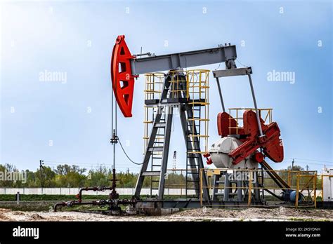 Extraction of crude oil in oilfield. Oil drilling rig pumps oil ...