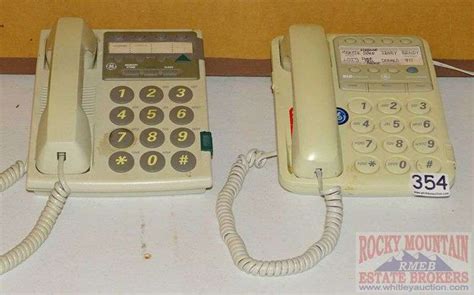 2 Extra Large Button Phones. - Rocky Mountain Estate Brokers Inc.