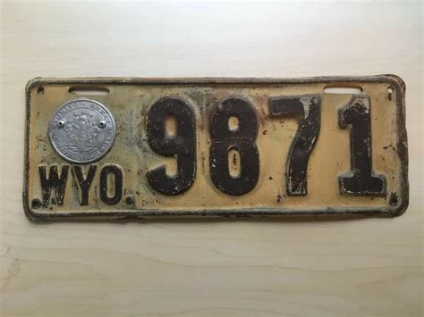 1917 Wyoming License Plate - KGAB AM 650