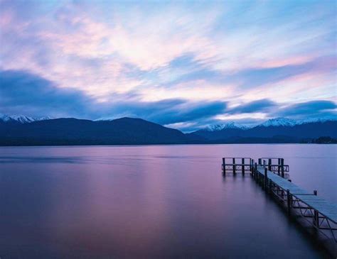 Lake Te Anau jetty at sunset in New Zealand #NZ_lakes #laketeanauNZ #NZ | New zealand lakes, New ...