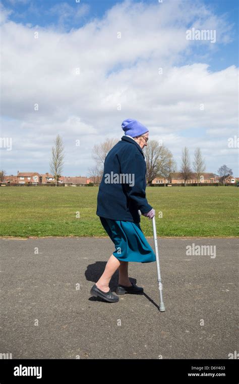 Old lady walking stick hi-res stock photography and images - Alamy