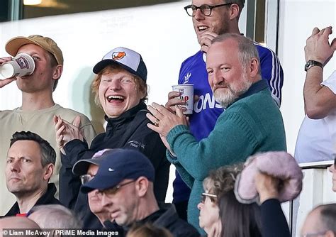 Ed Sheeran celebrates with his father John after his beloved team Ipswich Town storm to victory ...