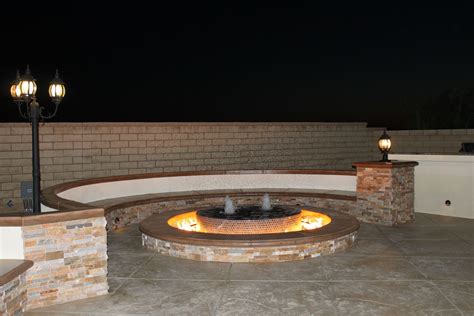 Water fountain-fire pit with stamped concrete flooring and split-face ...