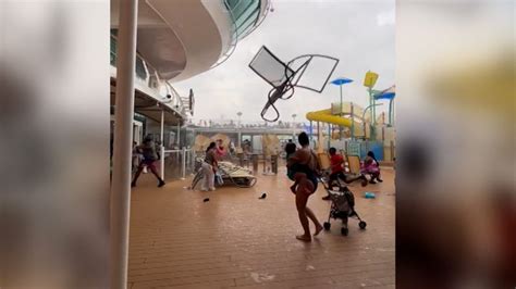 Watch cruise passengers flee flying lounge chairs, debris as storm hits ...