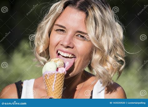 Girl Eating Ice Cream on Nature Stock Photo - Image of closeup, face ...