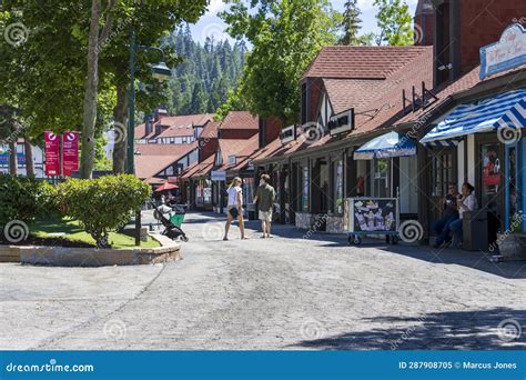 A Gorgeous Summer Landscape at Lake Arrowhead Village with People Walking, Retail Shops and ...