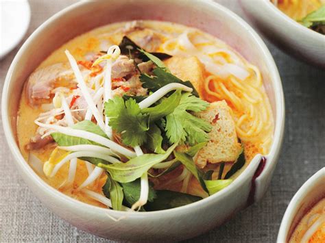 Spicy chicken noodle soup, chicken laksa is like soul food with fire. Quick, easy and nourishing ...